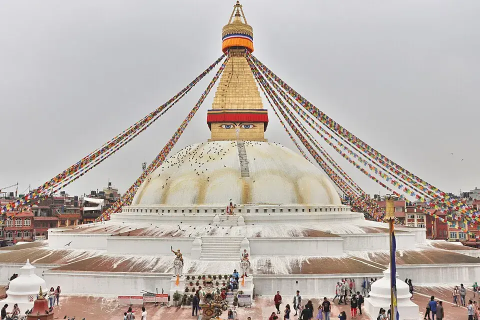 Boudhanath stupa and prayer flags in Kathmandu in bright daylight