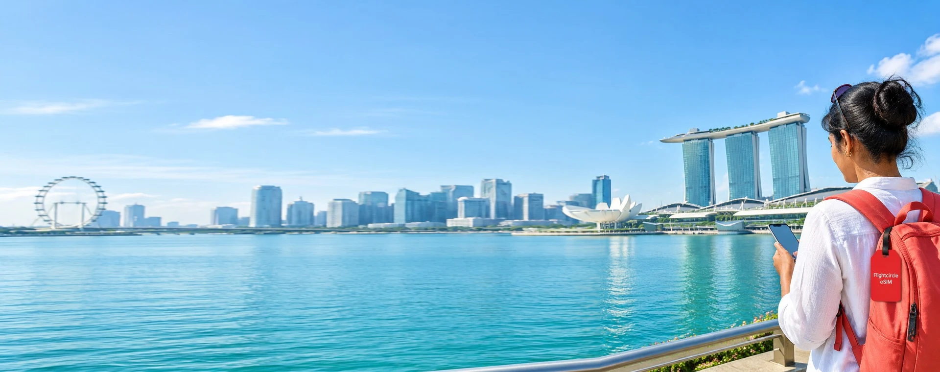 Traveler at Singapore's Marina Bay with a Flightcircle eSIM luggage tag